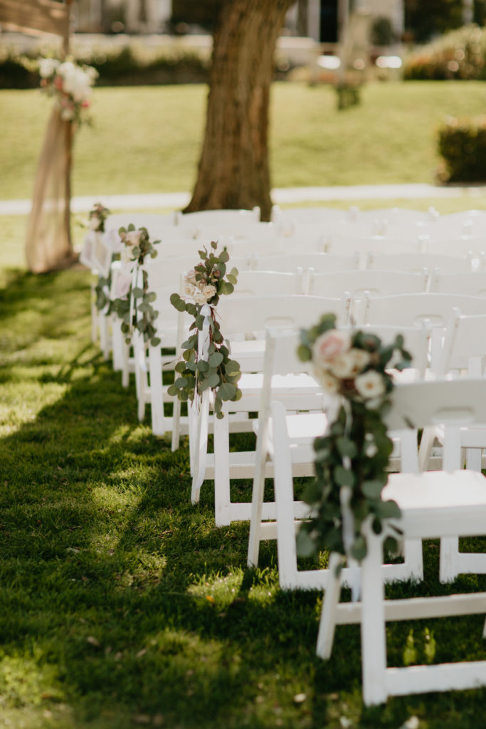 A music festival themed wedding ceremony at The Inn at Rancho Santa Fe, ceremony aisle flowers