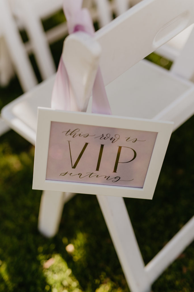 A music festival themed wedding ceremony at The Inn at Rancho Santa Fe, vip seat reserved sign