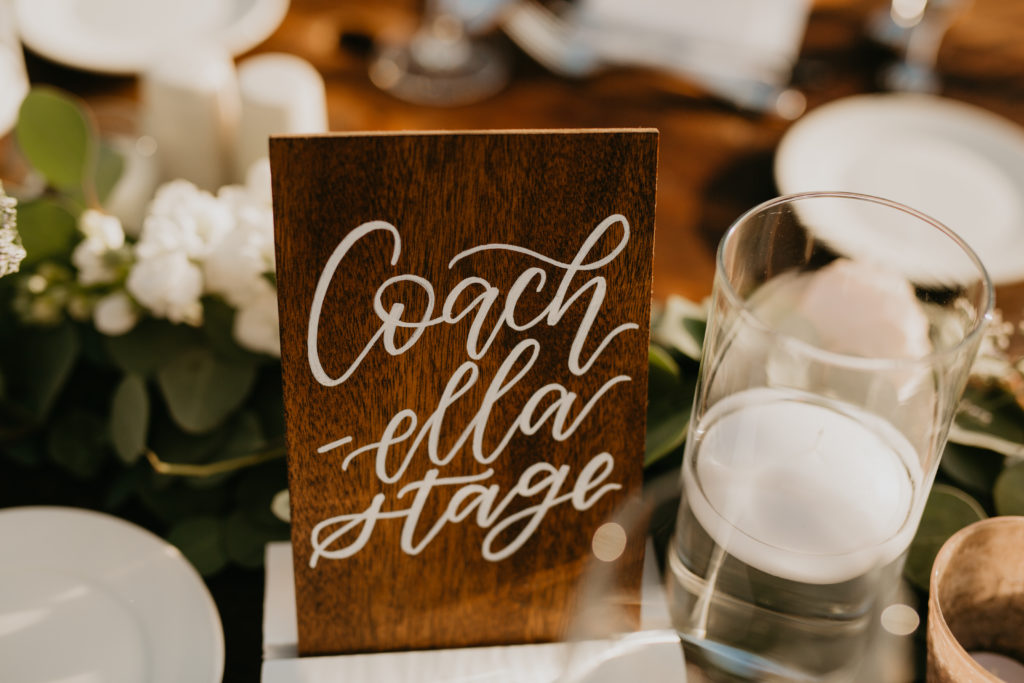 A music festival themed wedding reception at The Inn at Rancho Santa Fe, music venue table numbers 