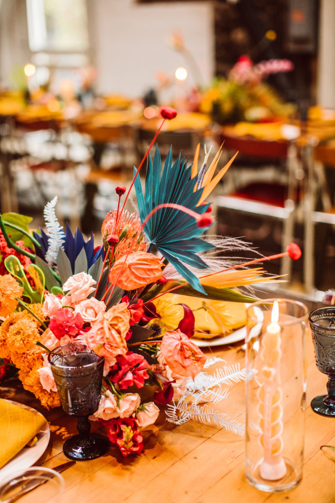 A unique and colorful wedding reception at the Grass Room in downtown Los Angeles, bright and eclectic table centerpieces