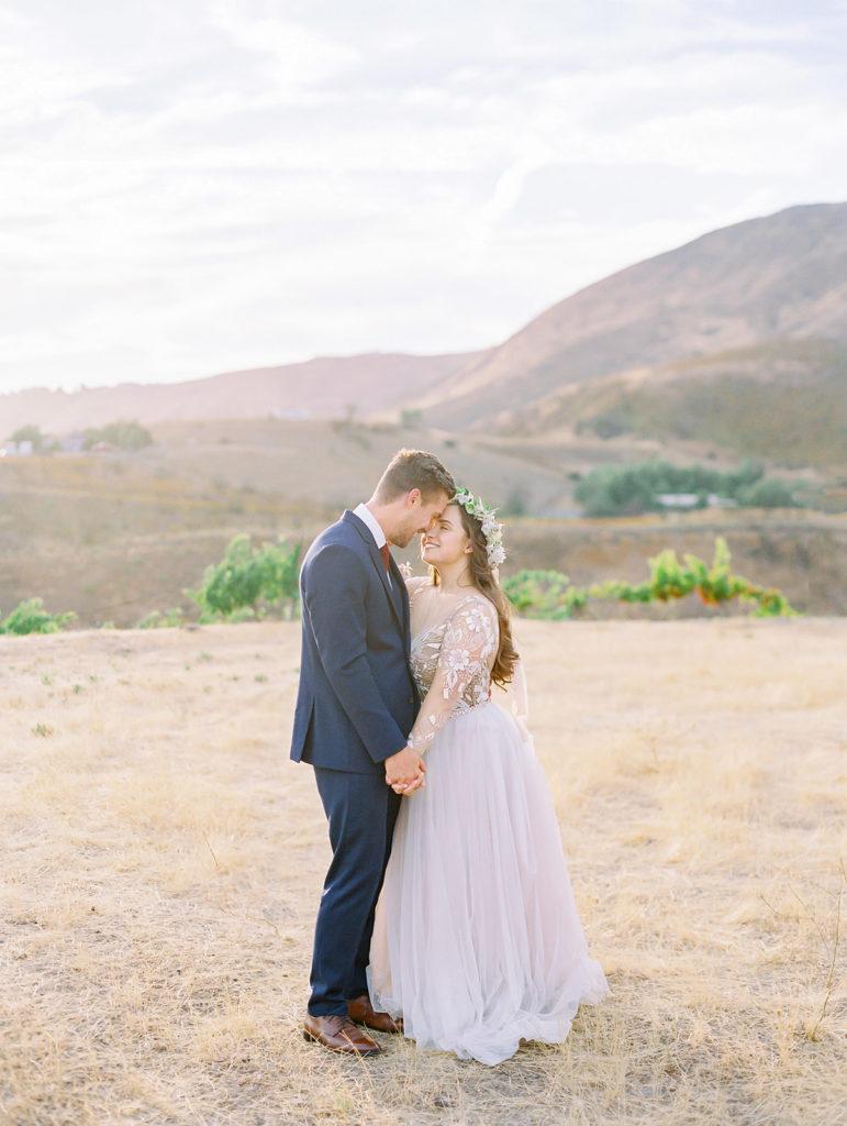 A colorful and vibrant wedding at Triunfo Creek Vineyards, sunset bride and groom portrait shot
