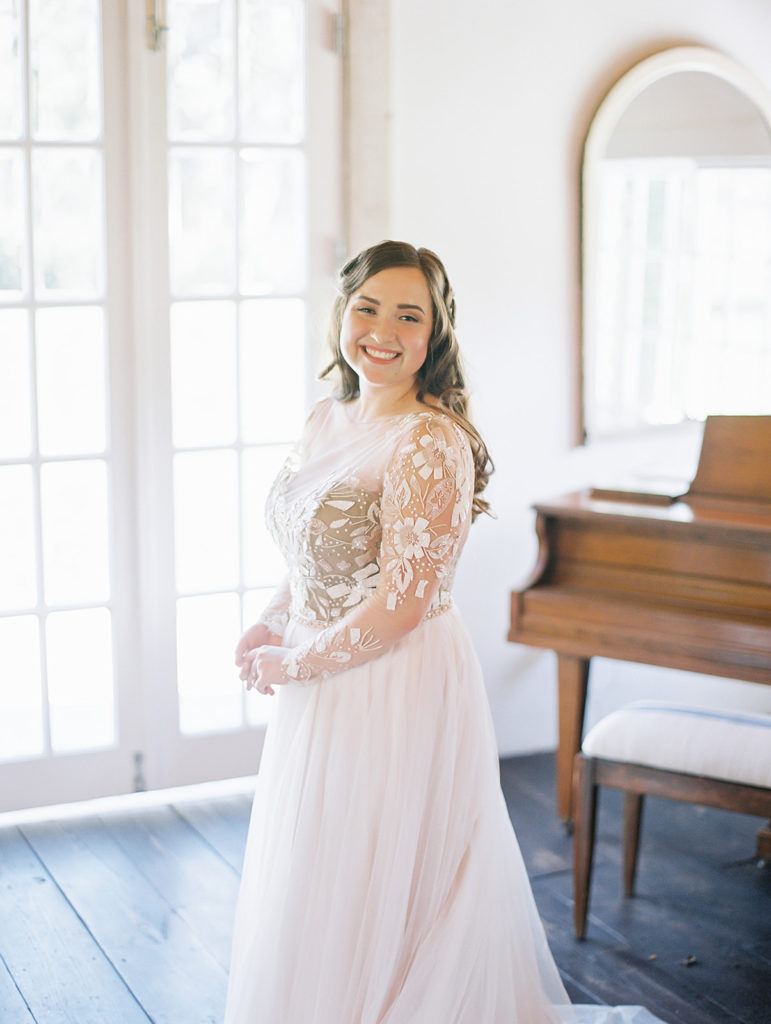 A colorful and vibrant wedding at Triunfo Creek Vineyards, bride wearing long sleeve wedding dress