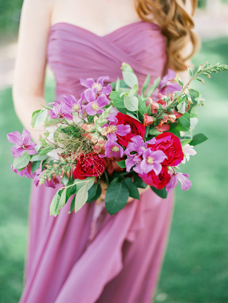 A colorful and vibrant wedding at Triunfo Creek Vineyards, bridesmaids in mix matching colorful dresses and bouquets