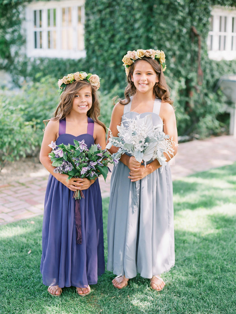 A colorful and vibrant wedding at Triunfo Creek Vineyards, flower girls in mix matching colorful dresses and bouquets