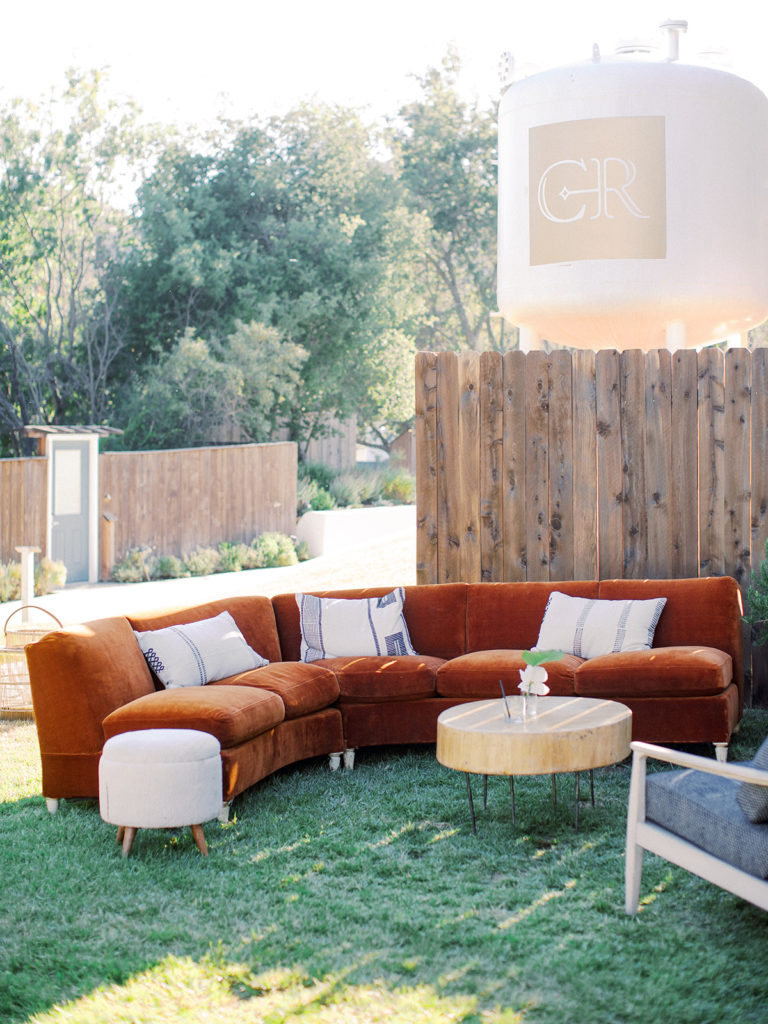 A California-cool rehearsal dinner at Calamigos Ranch, lounge with burnt orange couch 