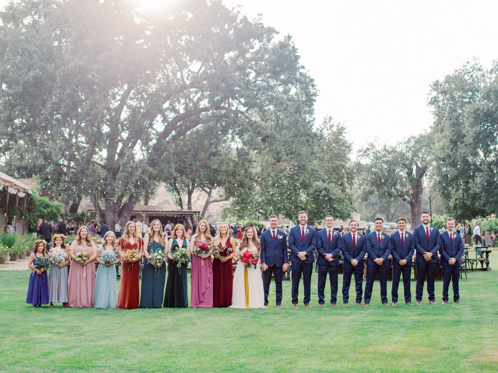 A colorful and vibrant wedding at Triunfo Creek Vineyards, mix matching wedding party outfits
