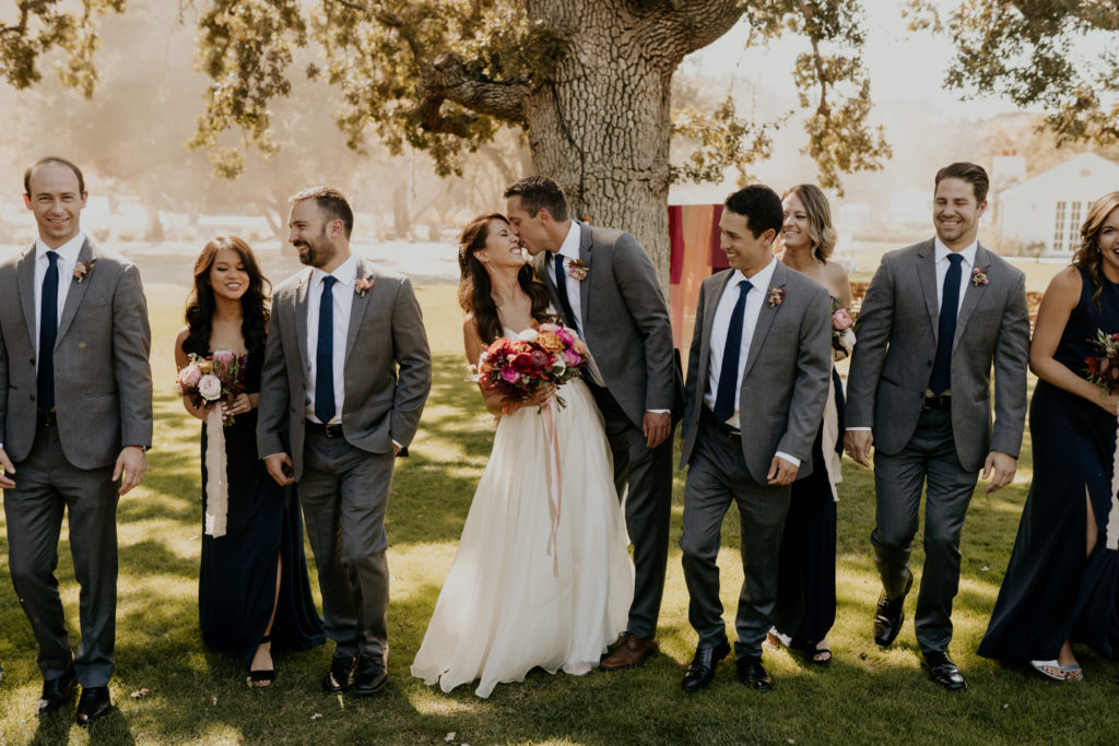 A whimsical wedding at Triunfo Creek Vineyards, navy blue bridal party