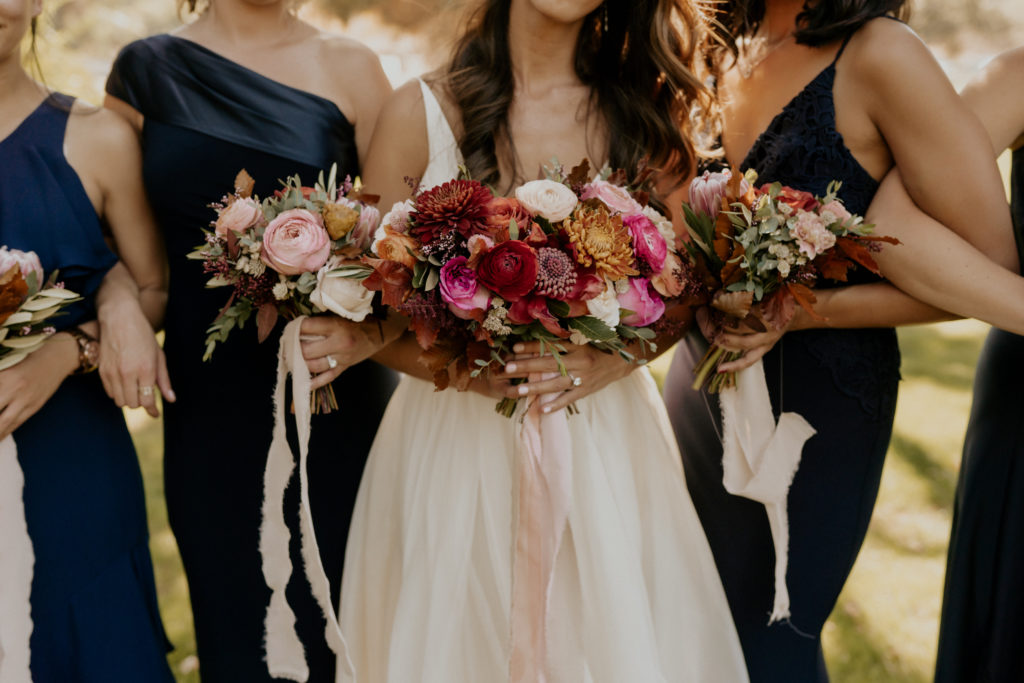 A whimsical wedding at Triunfo Creek Vineyards, pink and orange bridal bouquet