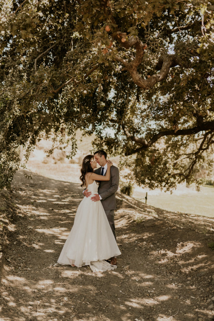 A whimsical wedding at Triunfo Creek Vineyards, bride and groom romantic portrait shot
