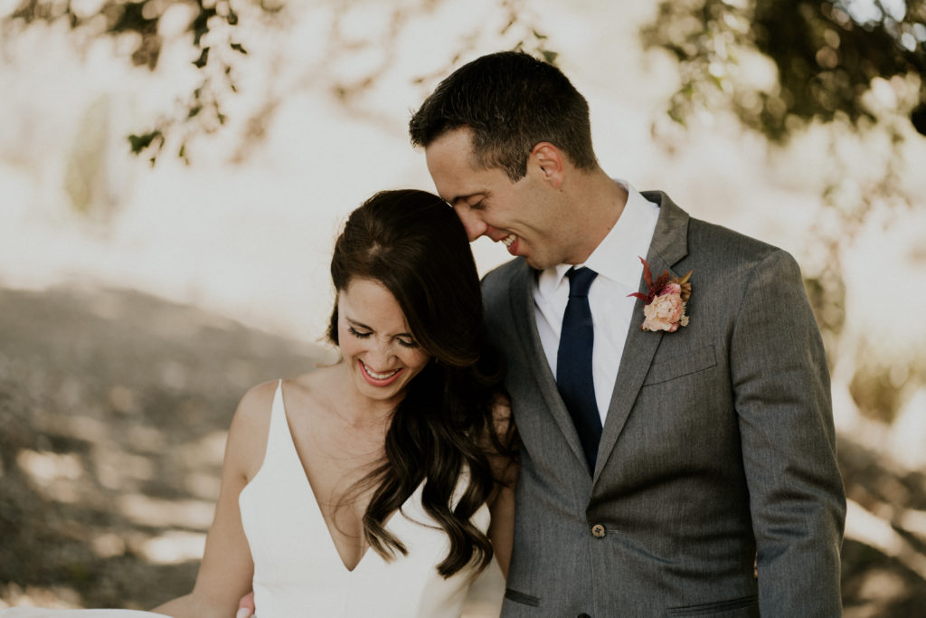A whimsical wedding at Triunfo Creek Vineyards, bride and groom romantic portrait shot