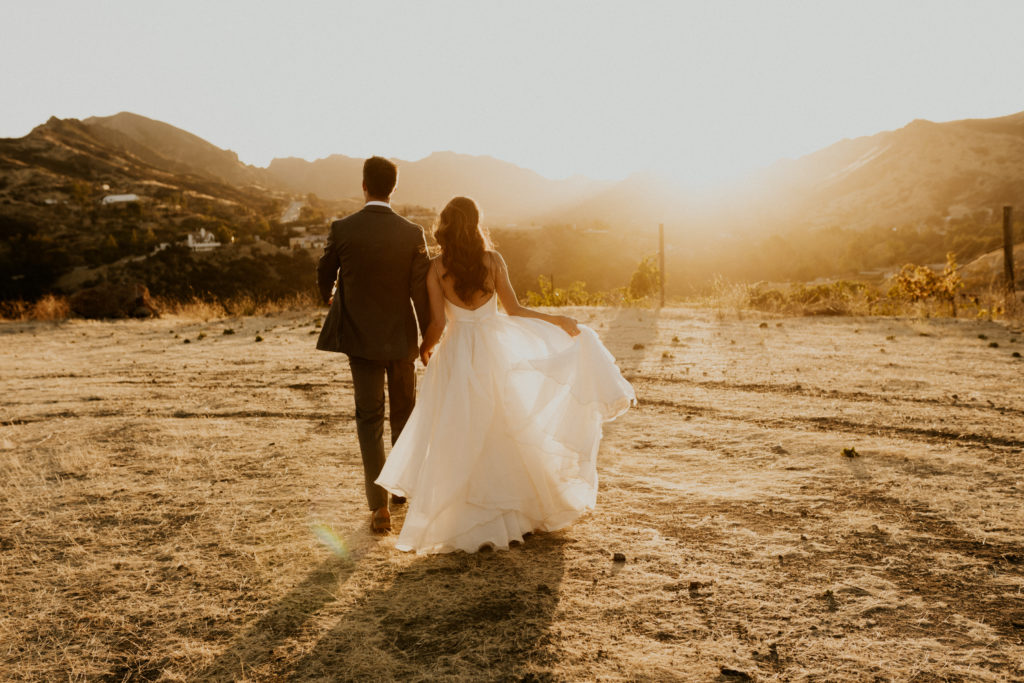 A whimsical wedding at Triunfo Creek Vineyards, sunset bride and groom portrait