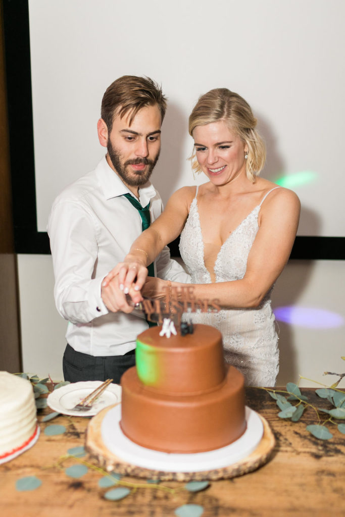 A Romantic Forest Inspired Wedding reception at the 1909, cake cutting