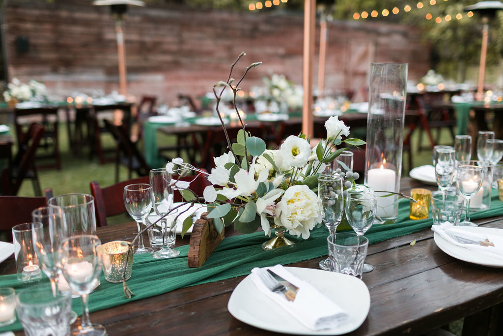 A Romantic Forest Inspired Wedding outdoor reception at the 1909, green chiffon table runner