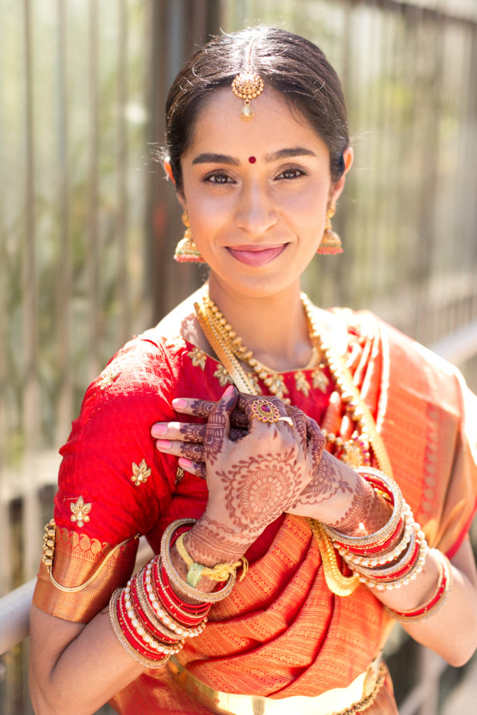 Bridal portrait shot with bride wearing red wedding saree