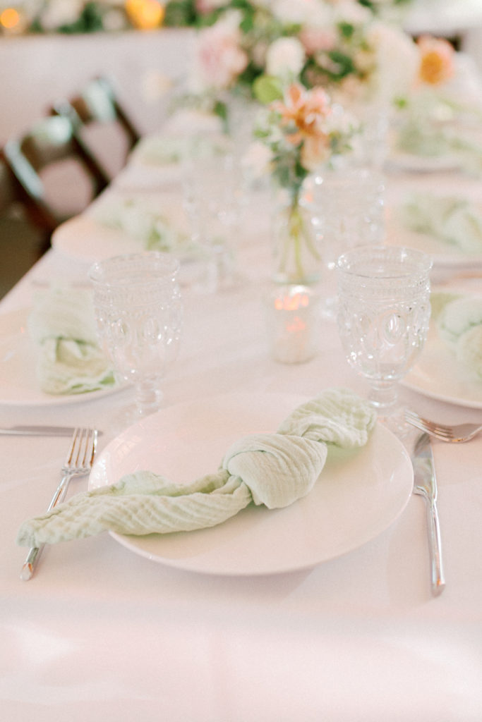 Wedding reception at the Environmental Nature Center, neutral draping with white linen and mint napkins