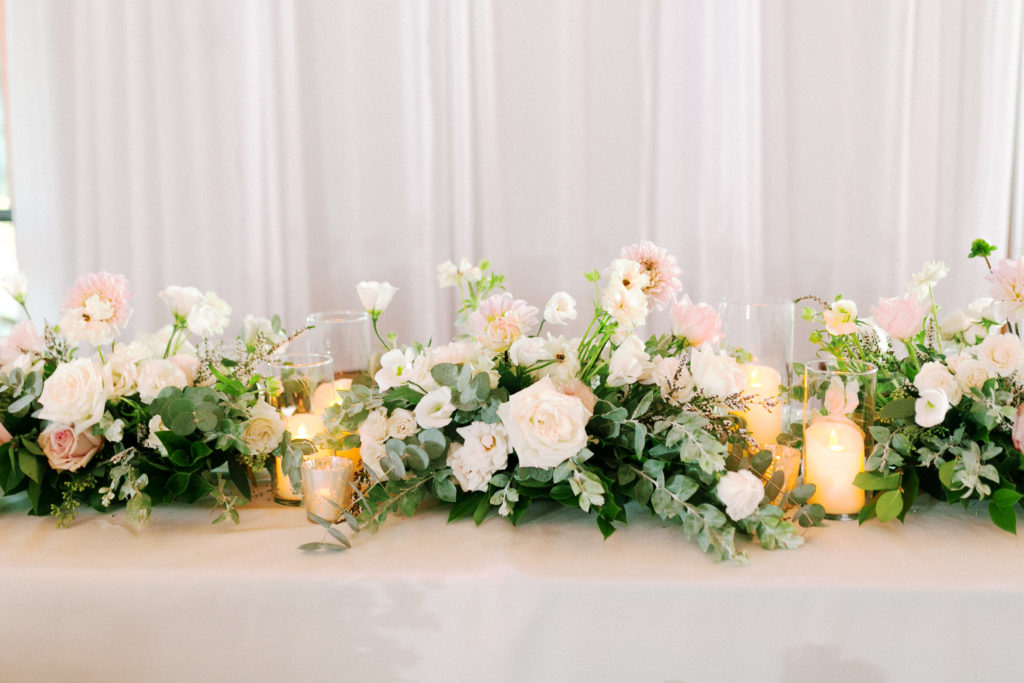 green and white floral centerpiece for wedding reception