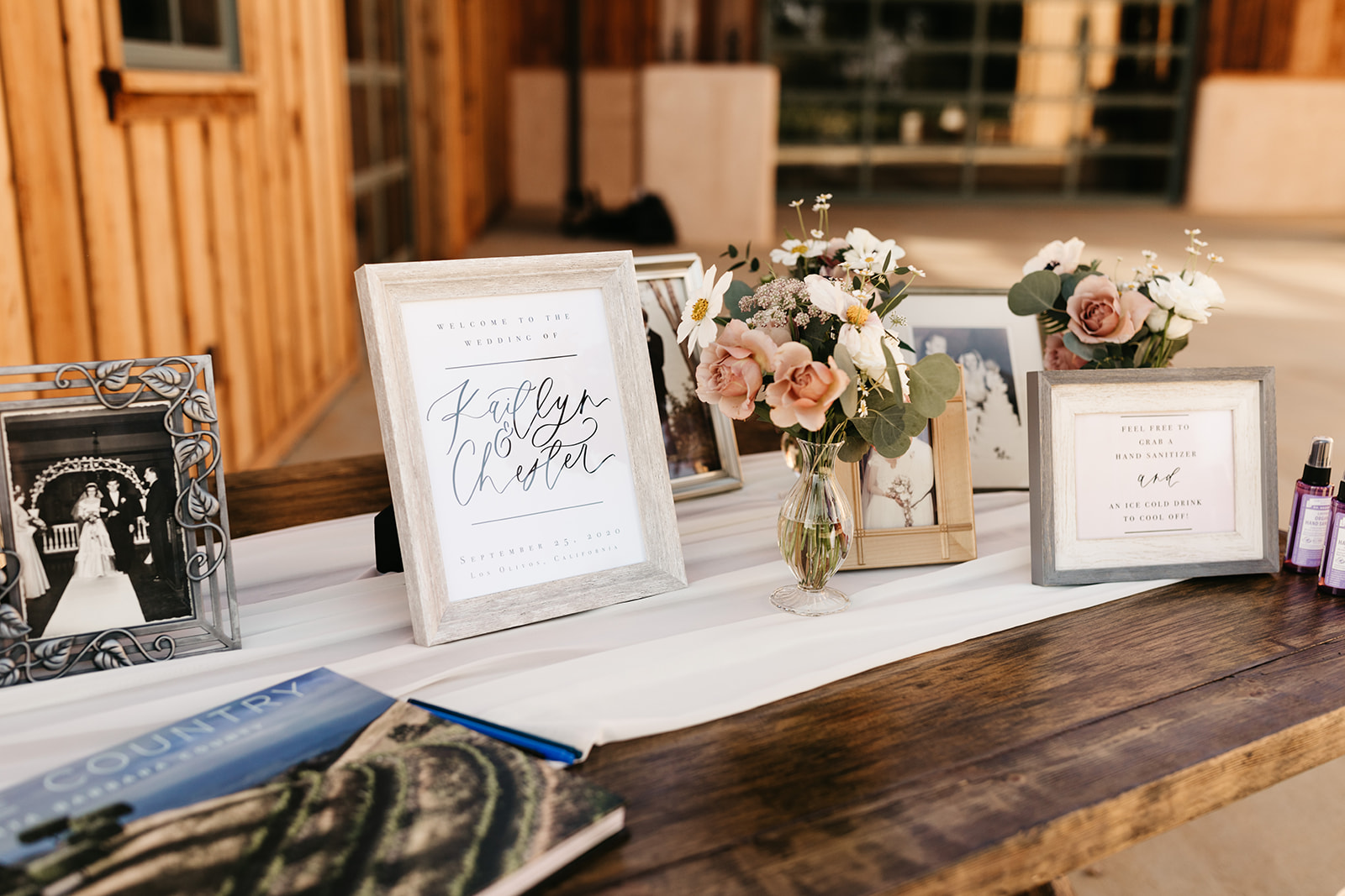 wedding welcome table with vintage family photos at Roblar Winery