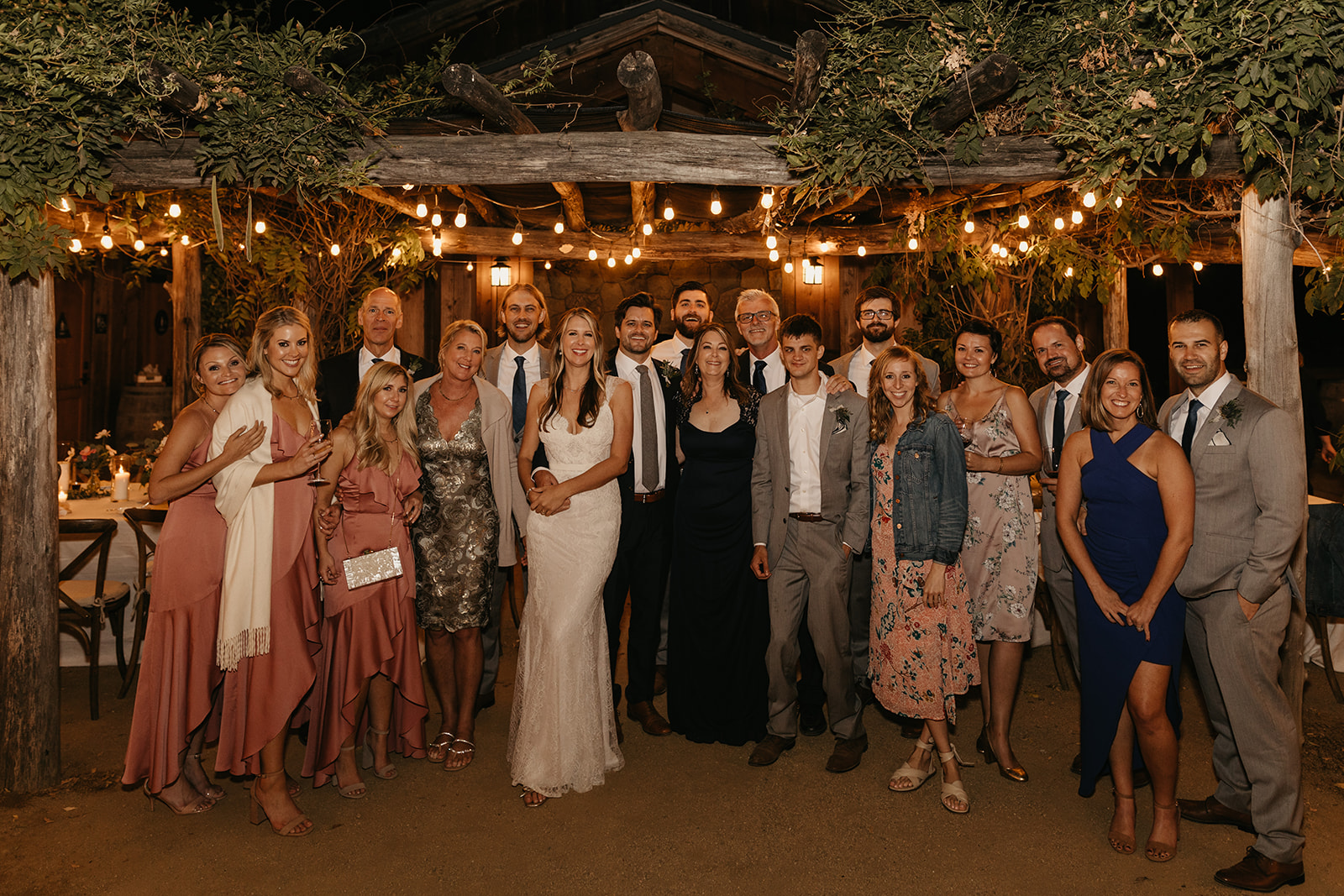 Couple poses with all their guests at this small, intimate vineyard wedding at Roblar Winery