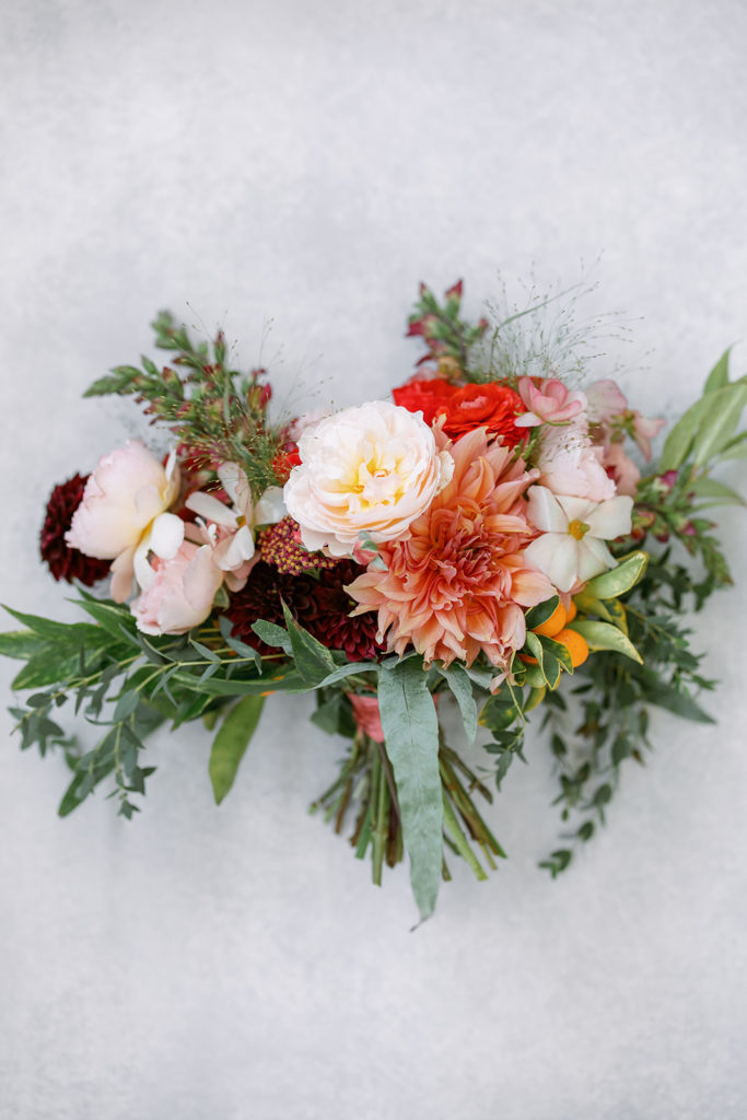 red, orange and pink bridal bouquet