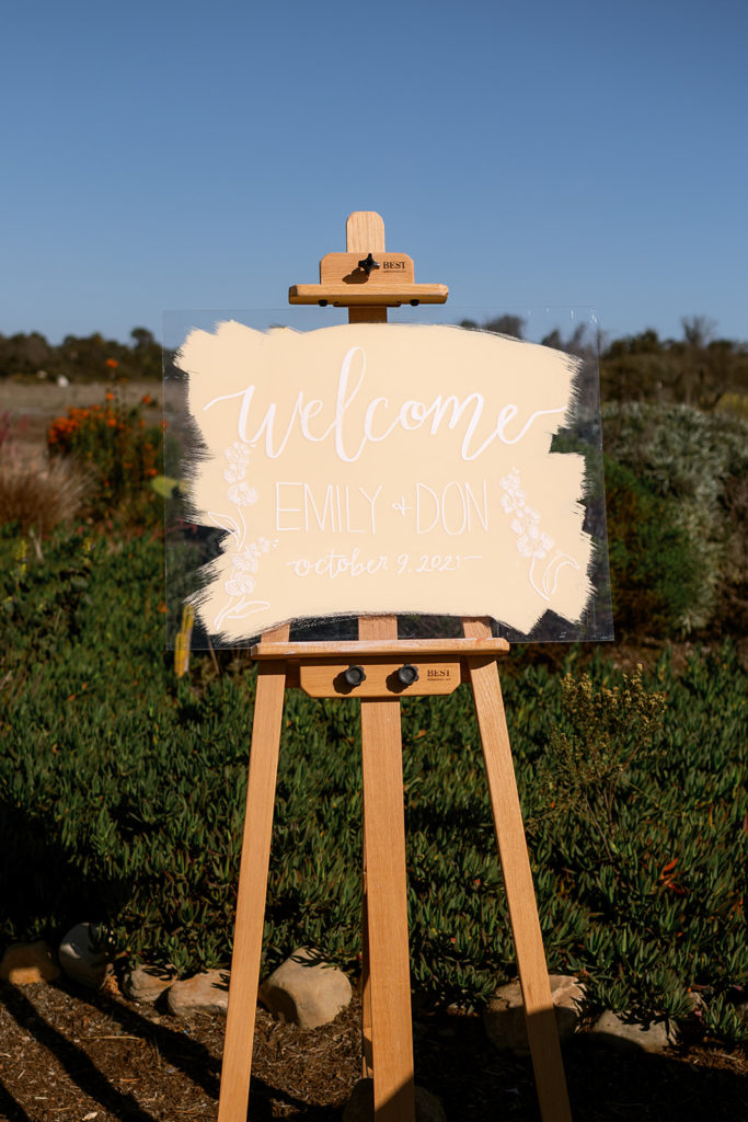 acrylic wedding welcome sign with light peach paint