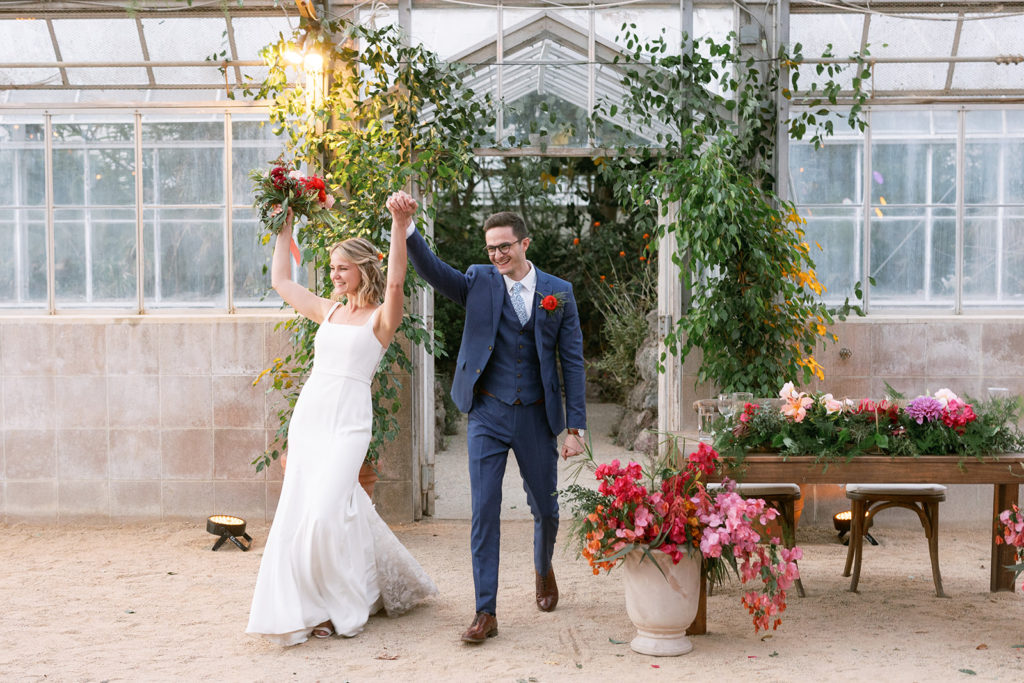 bride and groom enter wedding reception at Dos Pueblos Orchid Farm