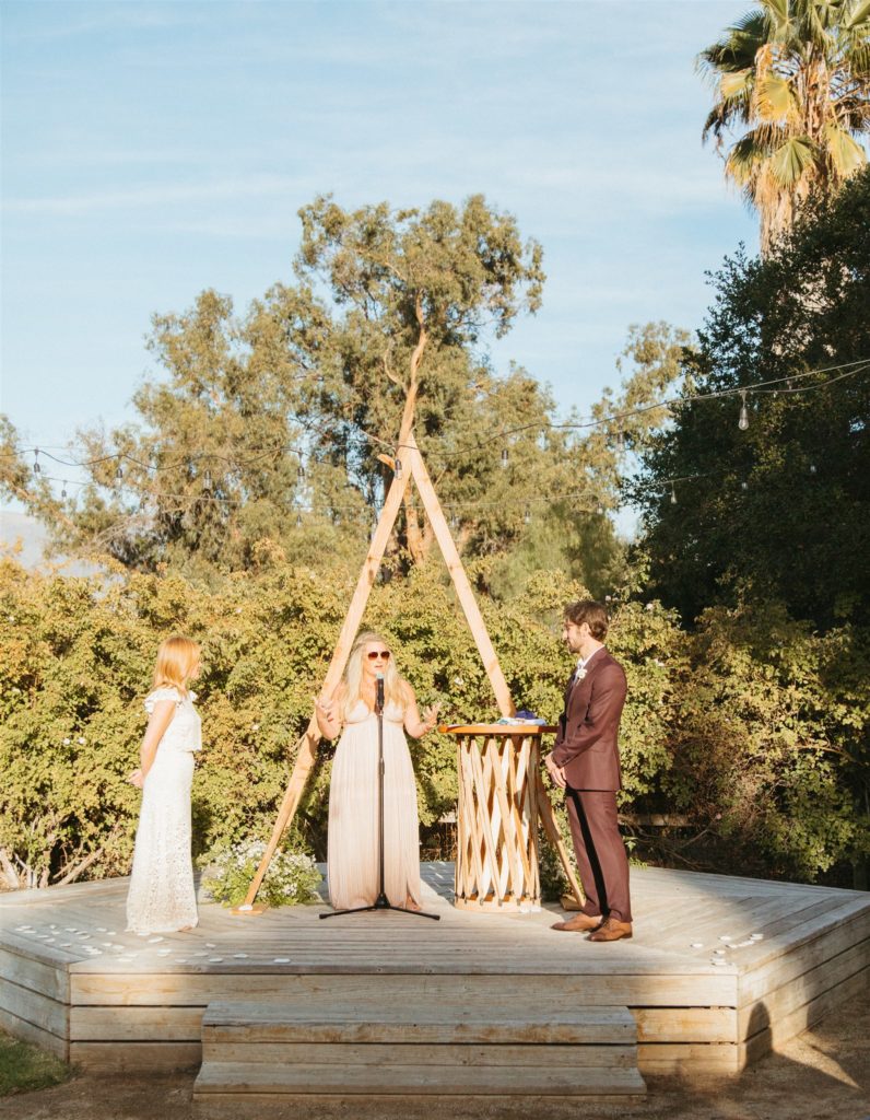 retro inspired wedding ceremony in Ojai with A-frame ceremony arch