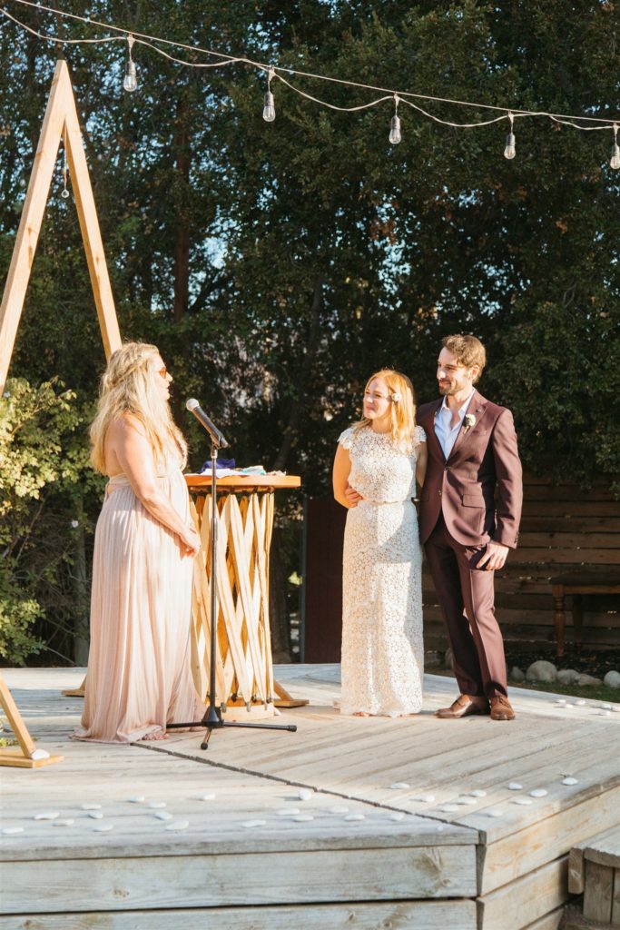 retro inspired wedding ceremony in Ojai with A-frame ceremony arch