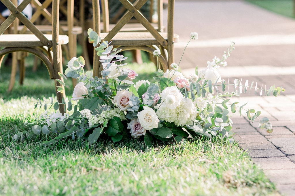 soft white, pink and green wedding ceremony aisle flowers for charming wedding at Maravilla Gardens