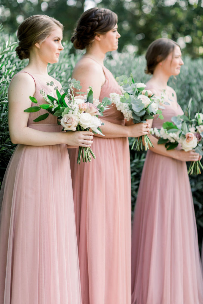 bridesmaids in soft pink dresses 