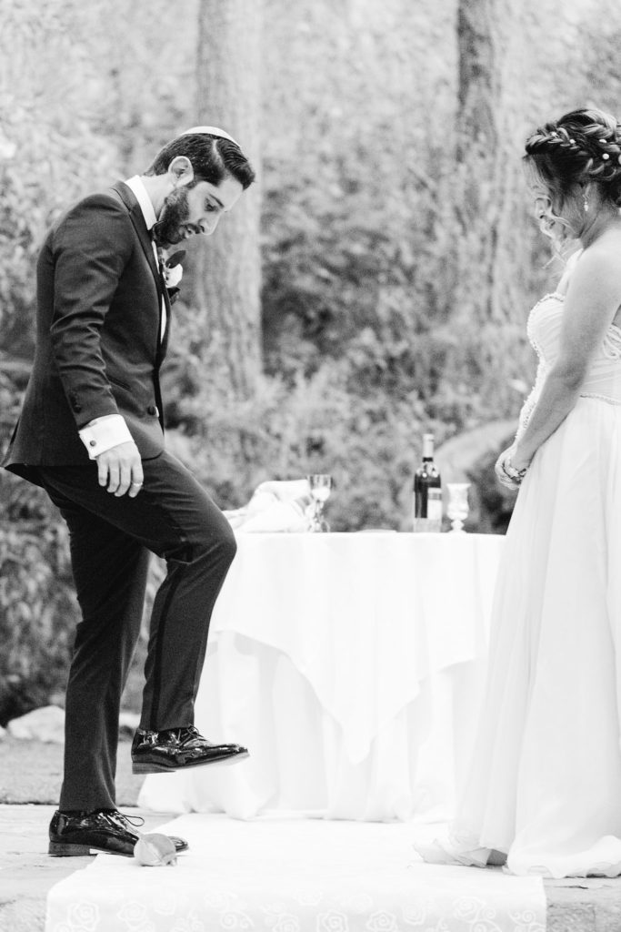 groom stomping on glass during Jewish wedding ceremony at Calamigos Ranch