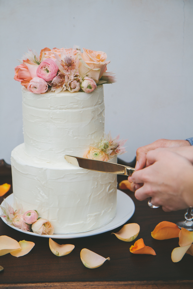 Rustic elegant styled wedding shoot, cake cutting