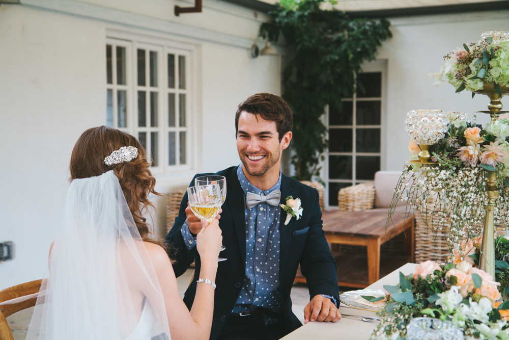 Rustic elegant styled wedding shoot, bride and groom toast