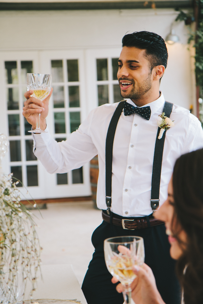 Rustic elegant styled wedding shoot, groomsmen with suspenders and bowtie