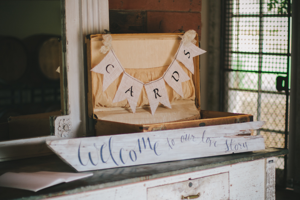 Rustic elegant styled wedding shoot, welcome table with luggage card box