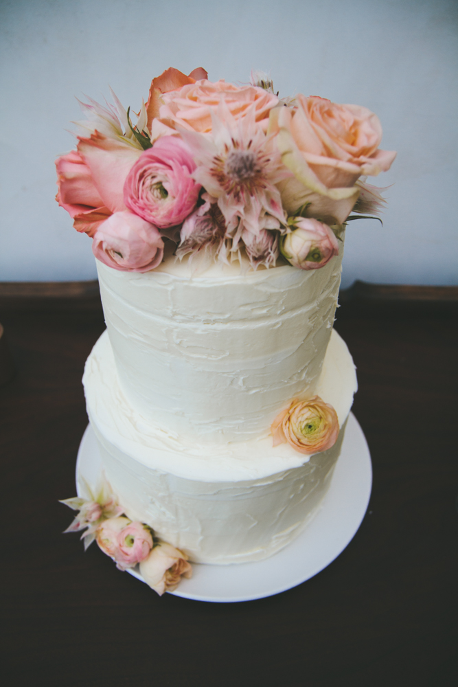 Rustic elegant styled wedding shoot, cake with blush and peach flowers