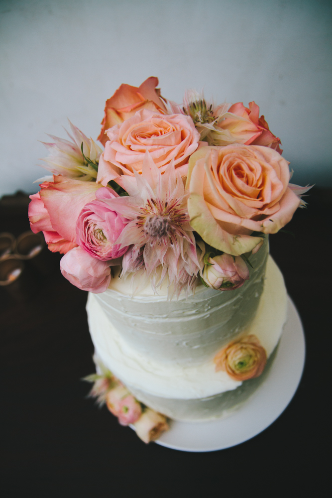Rustic elegant styled wedding shoot, cake with blush and peach flowers