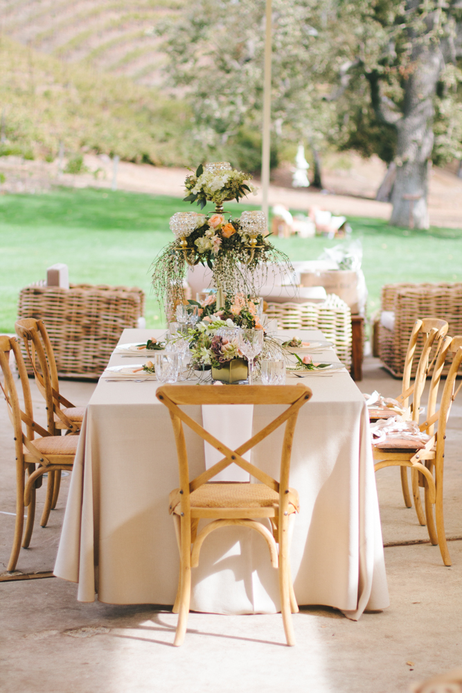 Rustic elegant styled wedding shoot, vintage tablescape with peach floral centerpieces