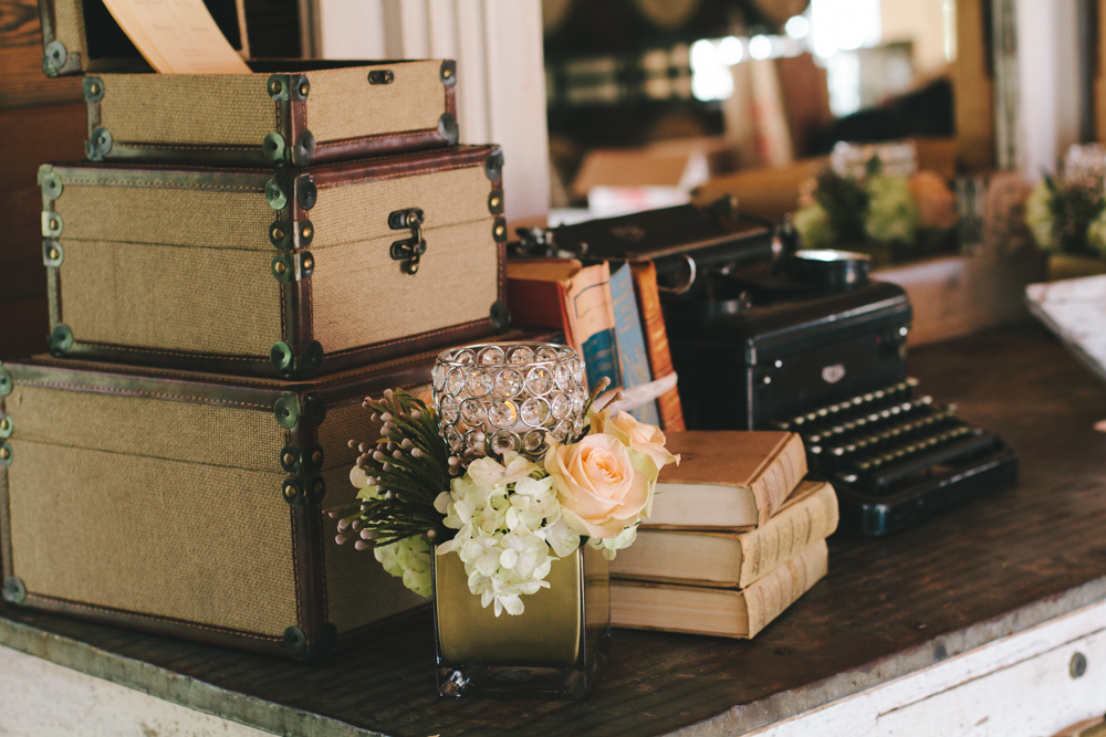Rustic elegant styled wedding shoot, vintage books at welcome table