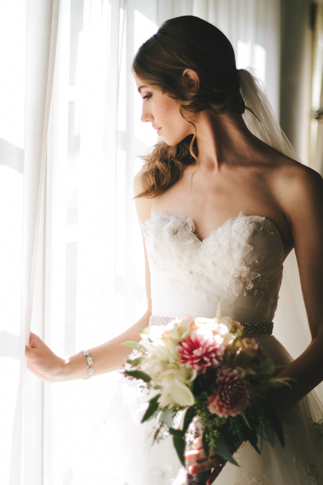 Rustic elegant styled wedding shoot, bride getting ready with bouquet, bridal hair and makeup