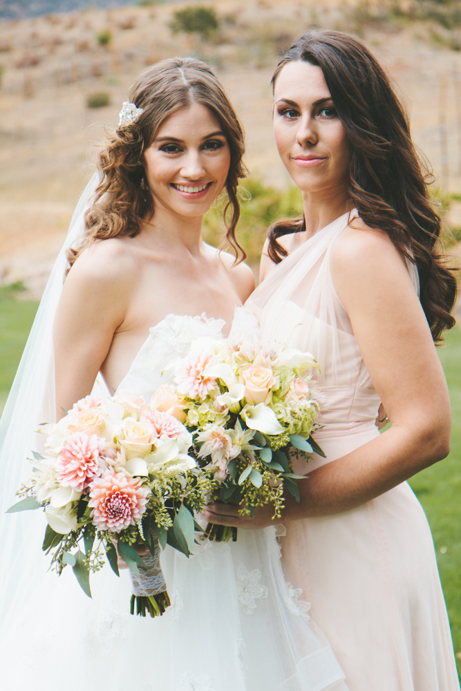 Rustic elegant styled wedding shoot, bride and bridesmaid with peach and blush bouquets