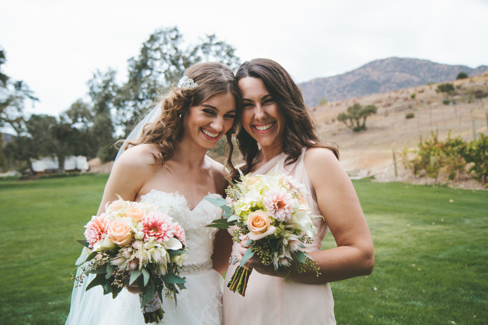 Rustic elegant styled wedding shoot, bride and bridesmaid with peach and blush bouquets