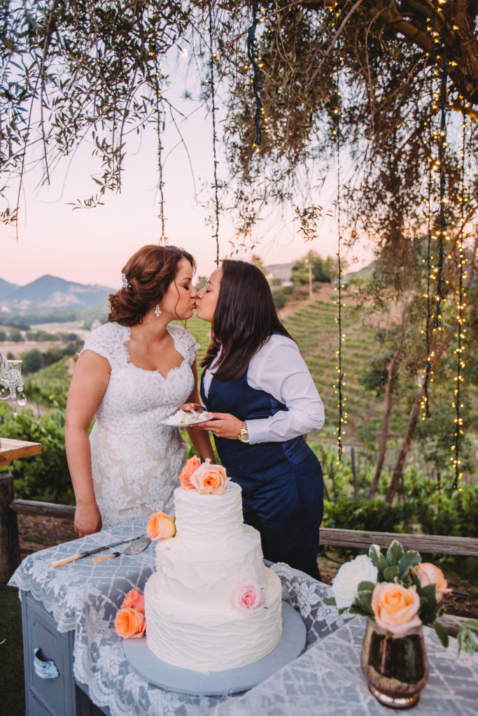 Saddlerock Ranch wedding bride and bride cutting the cake