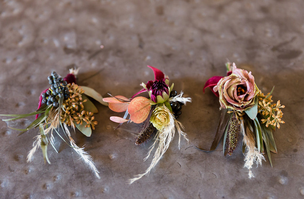 boho wedding boutonnieres with pampas grass and dark flowers at Triunfo Creek Vineyards
