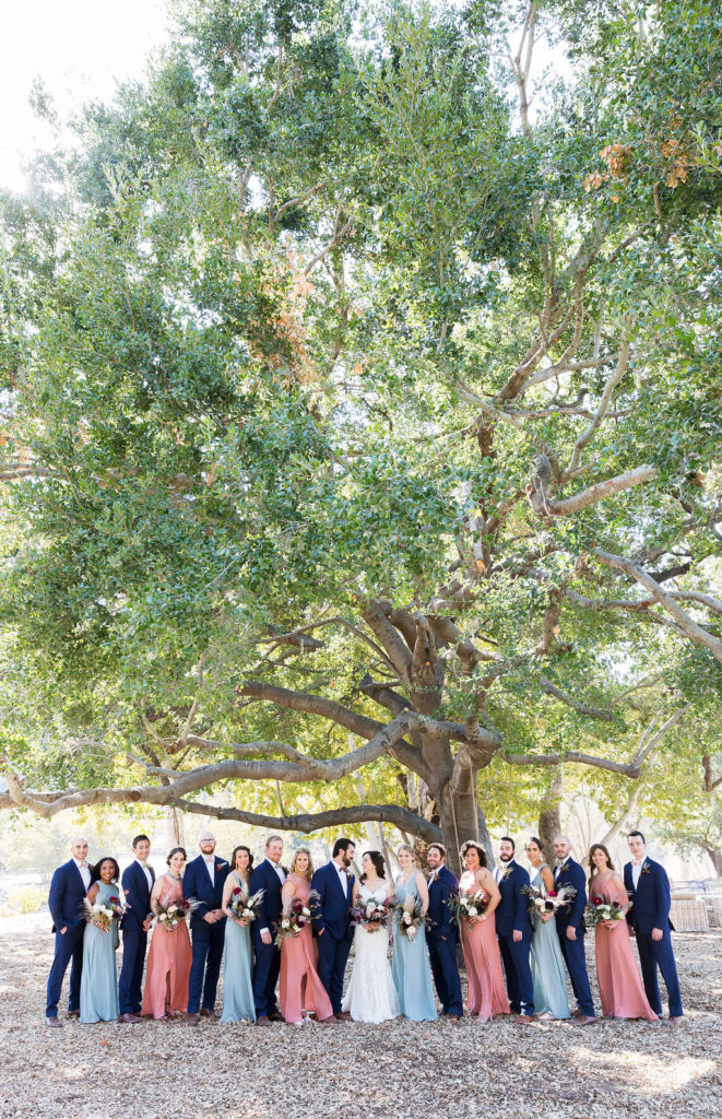Show Me Your Mumu pink and blue bridesmaids dresses and navy groomsmen tuxes