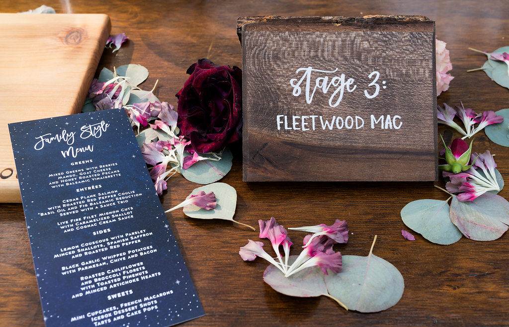 Wooden table numbers and menus for a wedding reception