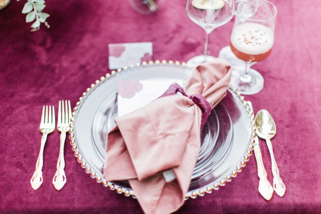 Wedding dinner place setting from Signature Party Rentals with velvet linens from La Tavola at Rancho Las Lomas
