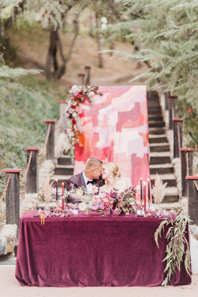 Semi-Monochromatic hand painted backdrop for wedding ceremony at Rancho Las Lomas Sweetheart table background