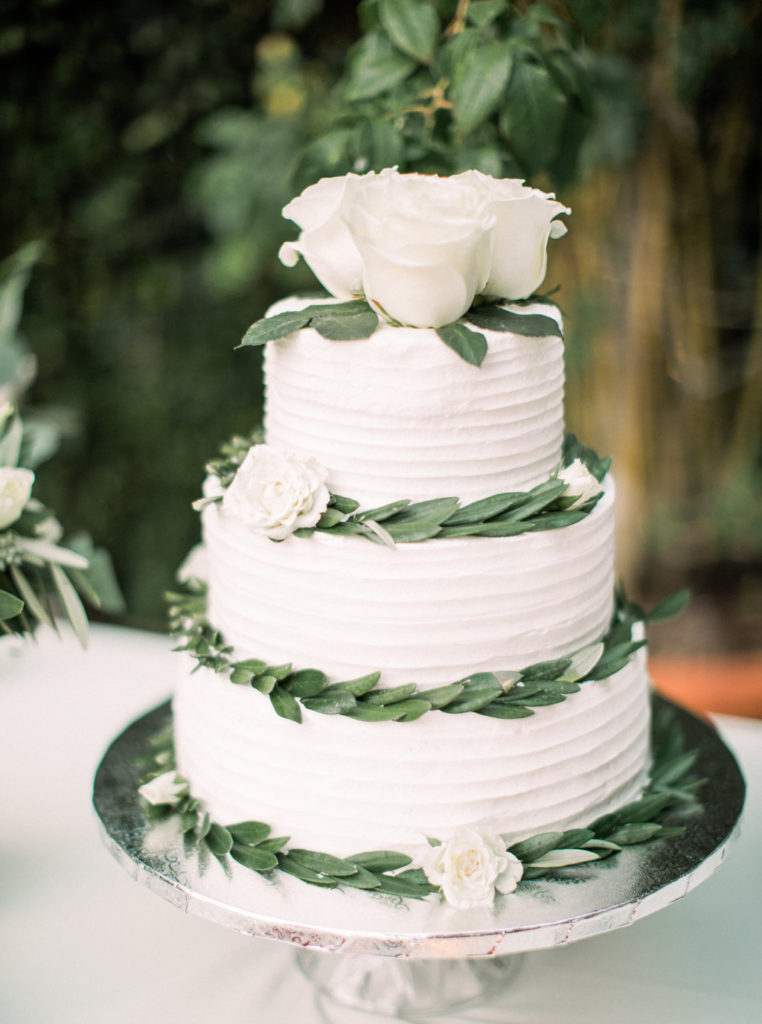 white wedding cake, white roses on wedding cake