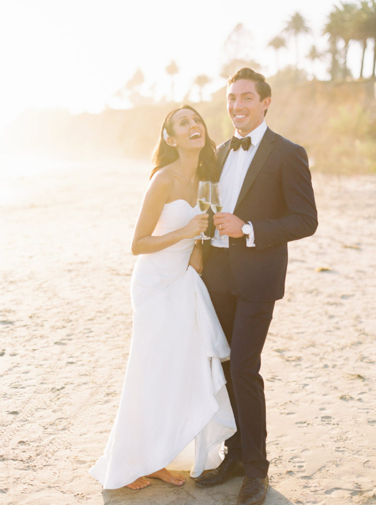 Sunset wedding photo, coastal beach wedding in Montecito, wedding champagne toast,