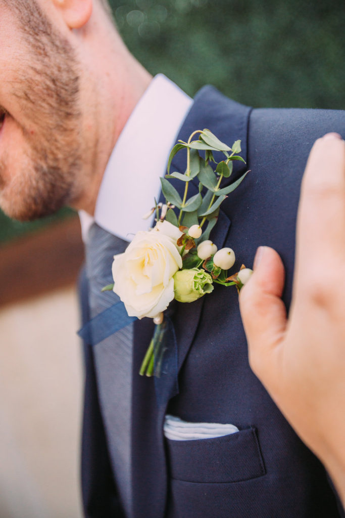 groom boutonniere with rose